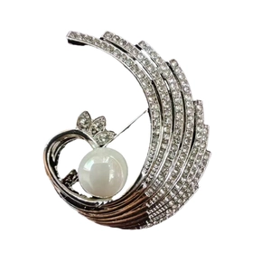 Elegant spiral phoenix brooch with pavé rhinestones and a large white pearl center
