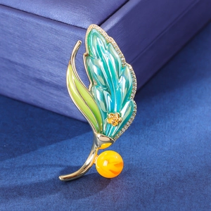 Elegant leaf brooch with blue enamel, gold rose, and zircon inlay on velvet box