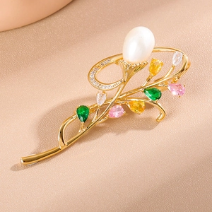 Elegant gold orchid brooch with white drop pearl and colorful cubic zirconia gems