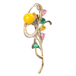 Elegant floral orchid brooch with yellow bead and colorful gems on gold branches