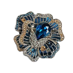 Elegant blue rose brooch with satin petals and teardrop crystal in silver setting