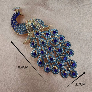 Elegant peacock brooch with blue crystals and golden alloy base for cheongsam, 8.4cm length