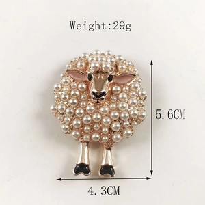 Detail view of a cute sheep brooch with white pearls and gold alloy, sized 5.6cm by 4.3cm