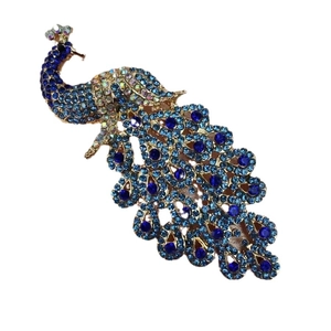 Elegant peacock brooch with blue crystals on gold metal base for qipao and coats