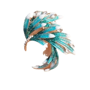 Elegant gold C-shape ear cuff with blue-green gradient feather wings and teardrop crystals