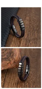Détail du bracelet en cuir tressé rouge et noir avec un fermoir magnétique en métal