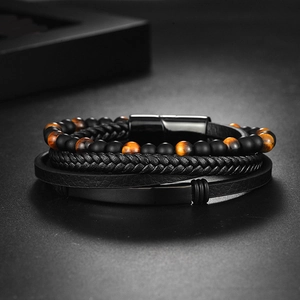 Detail view of multi-layer tiger eye stone beads and braided leather men's bracelet