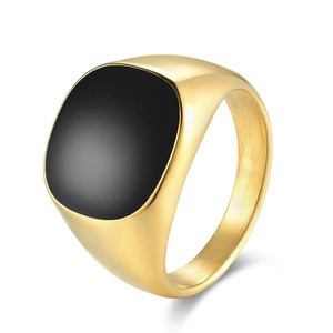 Classic gold stainless steel signet ring with a black square enamel stone on white surface