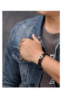 Close-up of black multi-layer braided leather bracelet with stainless steel accents