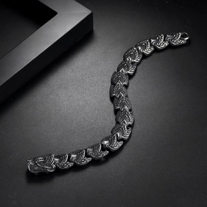 Detail of vintage punk dragon bracelet with intricate scale links and carved dragon head