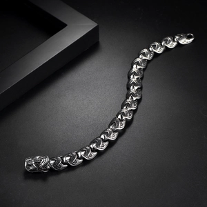 Macro shot of vintage hip hop dragon chain bracelet in oxidized stainless steel