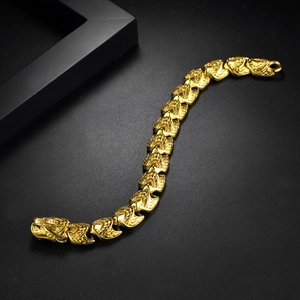 Detailed macro view of the punk dragon clasp and heavy golden stainless steel chain link