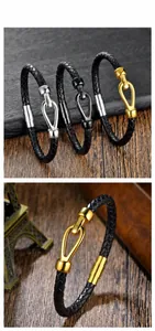 Detailed macro view of woven black leather bracelets with horseshoe steel buckles in three colors
