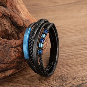 Men's multilayer black braided leather bracelet with blue metal plates on wood