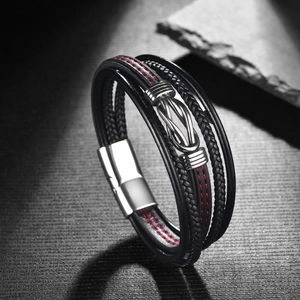 Macro detail of men's leather infinity bracelet with silver magnetic buckle