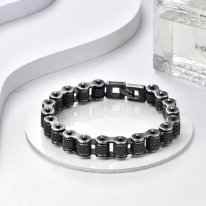 Detailed macro view of heavy vintage bike chain bracelet in black stainless steel