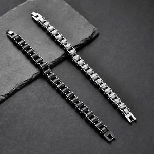 Men's stainless steel bike chain bracelet in black and silver with industrial textures