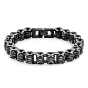 Punk style stainless steel motorcycle chain bracelet with knurled texture on white background