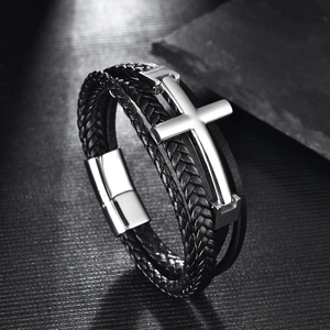 Men's black braided leather bracelet featuring a silver stainless steel cross and magnetic clasp