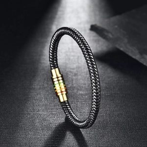 Detail of woven leather bracelet with rainbow magnetic clasp and golden steel finish