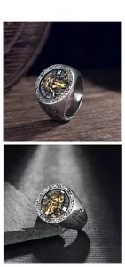 Close-up of vintage steel signet ring with Jesus relief and side cross detail