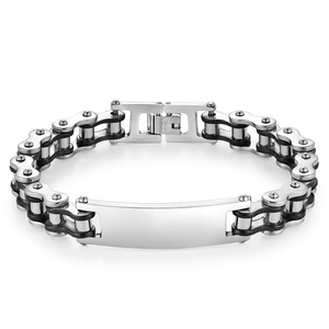 Detail of mechanical biker chain bracelet with silver engravable plate in stainless steel