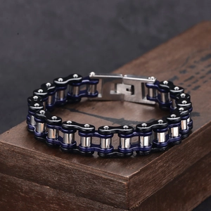 Detailed view of heavy mechanical bike chain bracelet in black, blue and steel finish