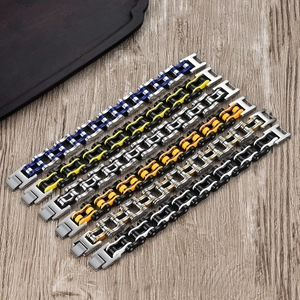 Detail view of industrial style bike chain bracelets with colorful inner links and H-buckle