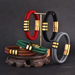 Detail showing colorful braided leather bracelets with gold magnetic clasps on display