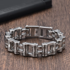 Detail of polished stainless steel bike chain bracelet with secure lobster clasp for men
