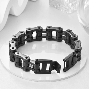 Close-up of black stainless steel bike chain bracelet for men with H-shaped folding clasp