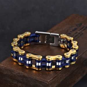 Detail of multi-color motorcycle chain bracelet with gold and blue steel links