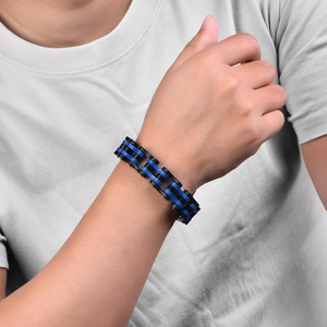 Detailed close-up of a men's stainless steel bicycle chain bracelet in black and blue