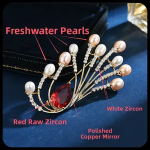 Detail of peacock brooch with red zircon, freshwater pearls, and mirror polished finish