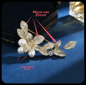 Detailed close-up of morning glory brooch with freshwater pearls and micro-set zircons