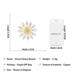 Sunflower zircon brooch in copper with marquise crystals shown with size comparison