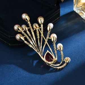 Elegant gold phoenix feather brooch with pearls and teardrop red gemstone jewelry