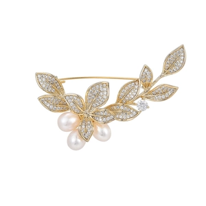 Exquisite golden morning glory brooch with freshwater pearls and sparkling cubic zirconia