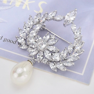 Detailed view of silver wreath brooch featuring marquise zircons and a pear-shaped pearl