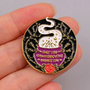 Enamel brooch pin featuring magical purple cauldron and quote Only You Can Decide What Breaks You