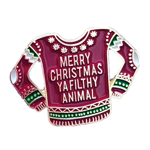 Enamel Christmas sweater brooch with Merry Christmas Ya Filthy Animal text in burgundy