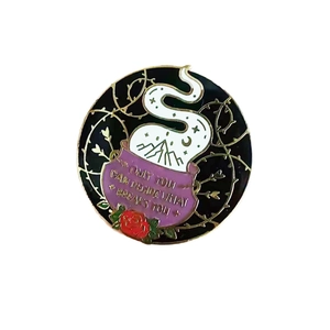 Enamel brooch with floral design and Only You Can Decide What Breaks You quote