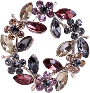 Exquisite flower brooch with crystals on a circular gold base for suit jackets