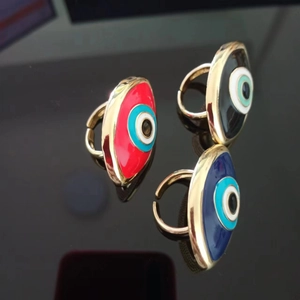 Three gold evil eye adjustable rings in red, black and blue enamel finishes
