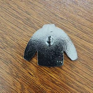 Back view of silver metal snowman sweater brooch pin with secure butterfly clutch