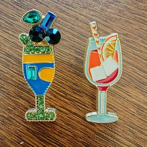 Detailed view of cocktail glass brooches with crystal inlay and enamel on wood