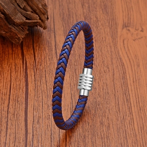 Detail of blue and brown braided leather bracelet with silver textured magnetic clasp