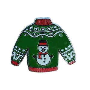 Green Christmas sweater enamel pin with snowman pattern and red wave accents