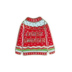 Christmas sweater enamel brooch with Cutest Sweater slogan in festive red and gold