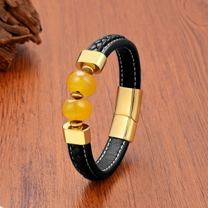 Close-up of leather men's bracelet with yellow beads and golden magnetic clasp